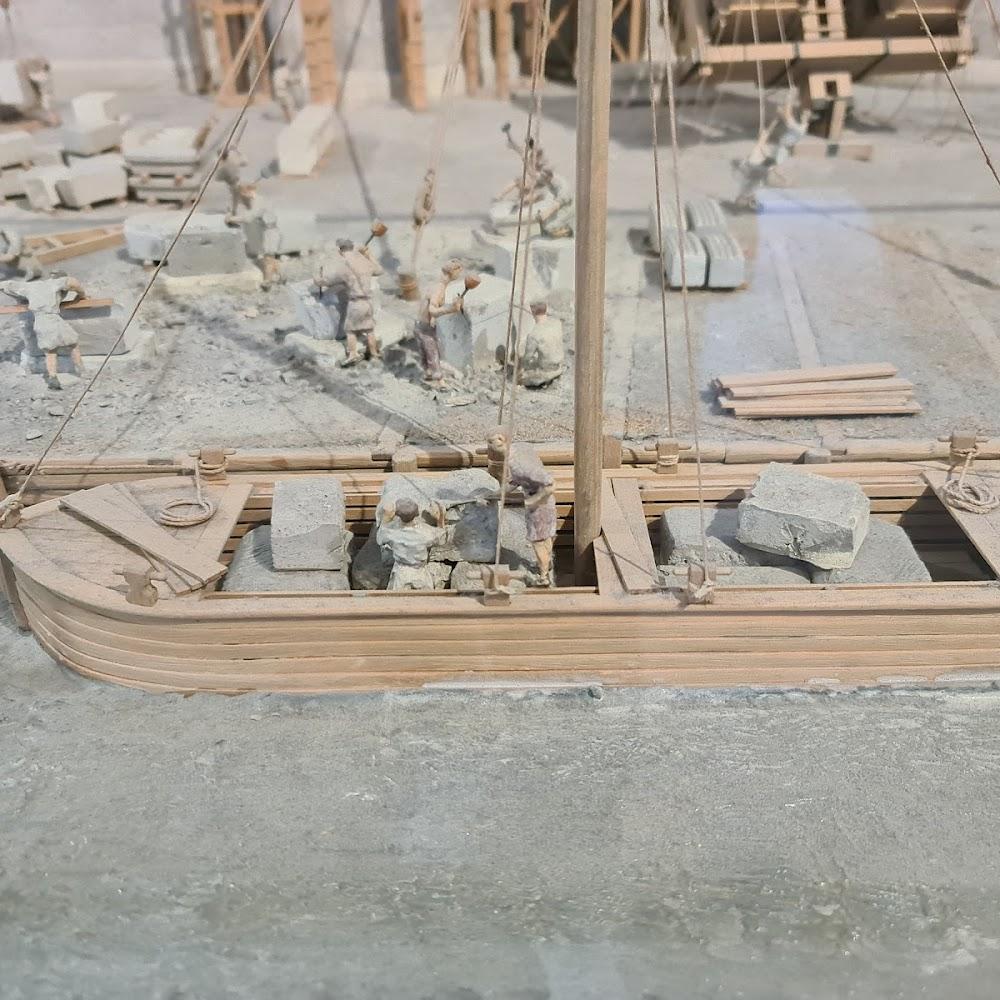 A model of a boat loaded with stones.